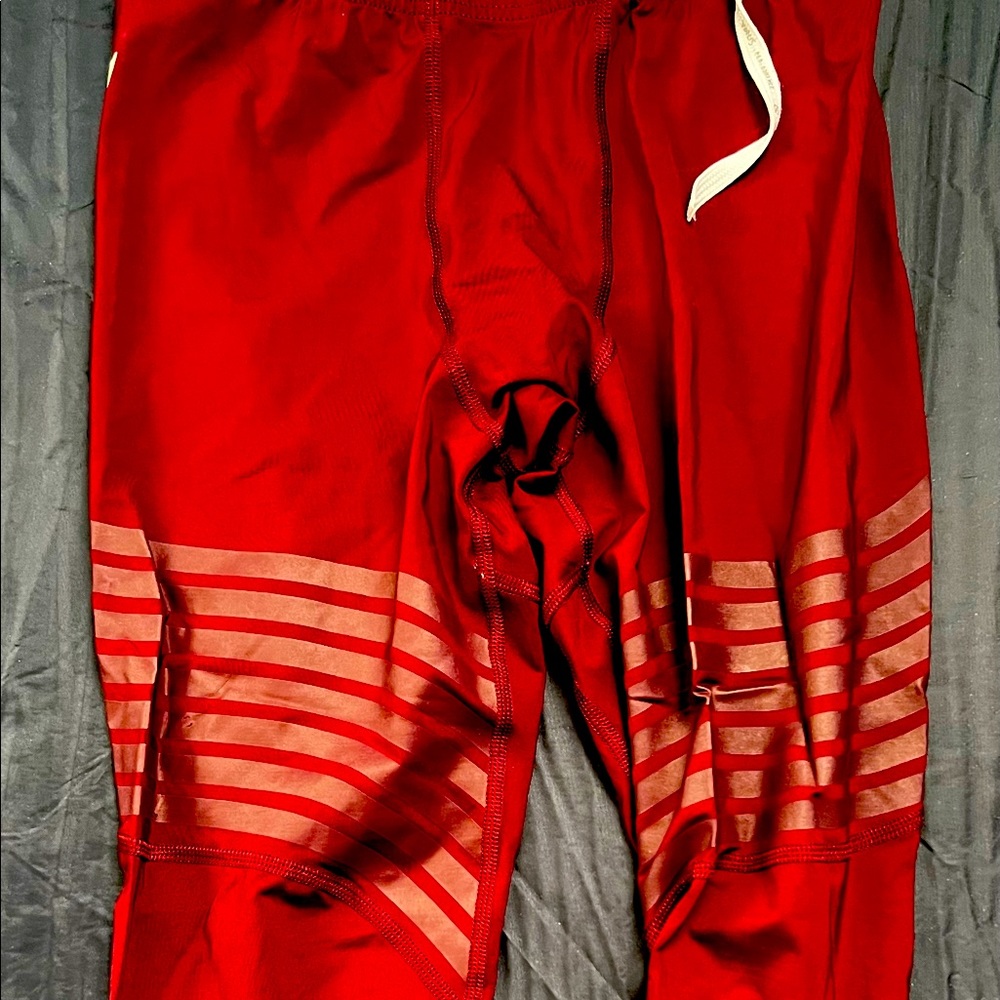 Men’s size medium 3/4 length Virus leggings. Red.